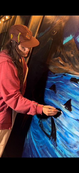 Hannah Jane painting a mural
